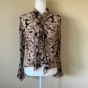 Brown and black floral blouse.